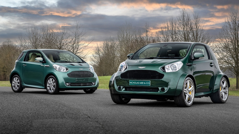 A photo of an Aston Martin Cygnet and the Aston Martin Super Cygnet.