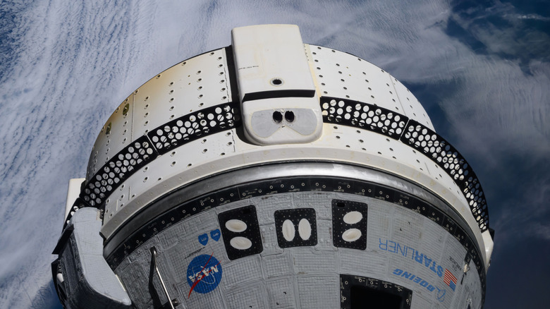 A photo of Starliner docked with the ISS.