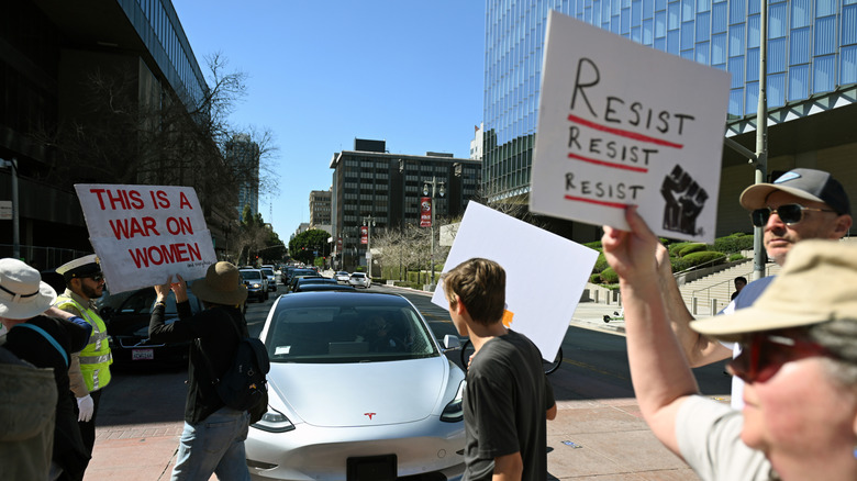 Protest outside Tesla dealership