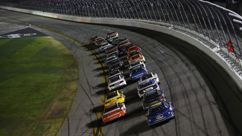 A photo of Nascar racers on track.