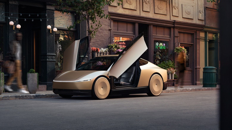 A parked Tesla Cybercab with open doors.