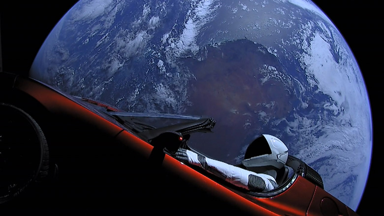 In this handout photo provided by SpaceX, a Tesla roadster launched from the Falcon Heavy rocket with a dummy driver named 