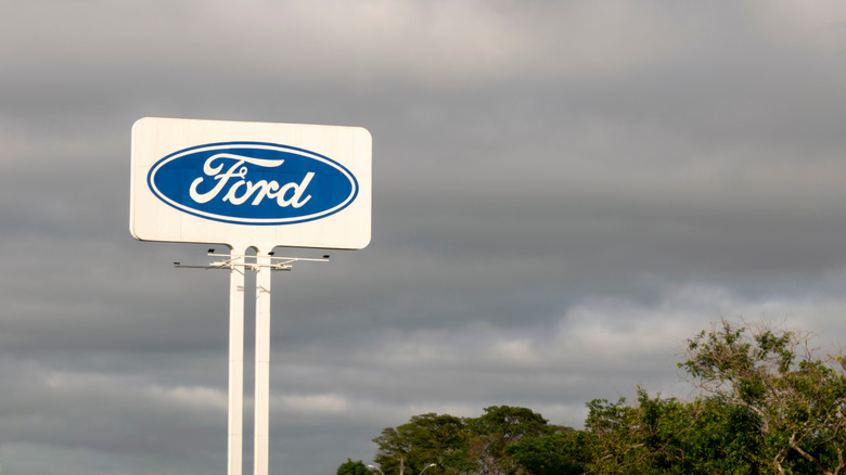 A photo of a Ford logo on a stalk.