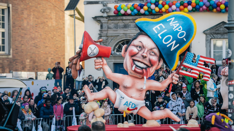 A carnival float mocks Elon Musk, the German party AfD and the US during the annual Rose Monday parade during carnival on March 03, 2025 in Dusseldorf, Germany.