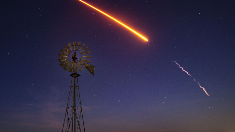 SpaceX, an American aerospace manufacturer, successfully launches a pre-dawn (under a crescent moon) a Falcon 9 rocket with multiple Starlink satellites from Vandenberg Space Force Base on January 24, 2025, in Lompoc, California.