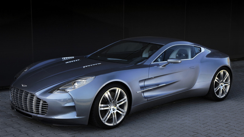 A photo of a blue Aston Martin One-77 supercar.