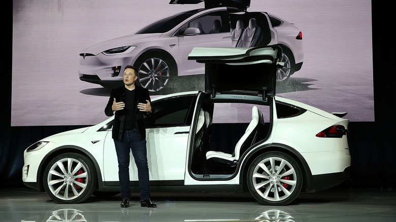 Elon Musk in front of a Tesla Model X