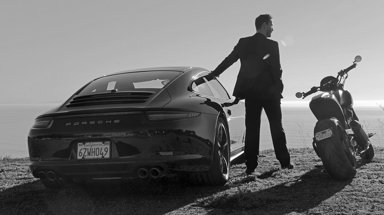 Keanu Reeves with his 997 Porsche 911 and motorcycle