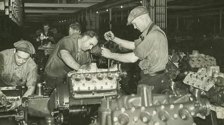 Workmen assembling Ford flathead V8 engines