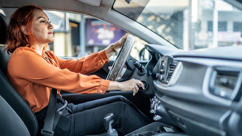 Mid adult woman driving a car