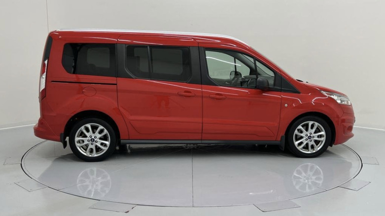 A red, used 2014 Ford Transit Connect XLT