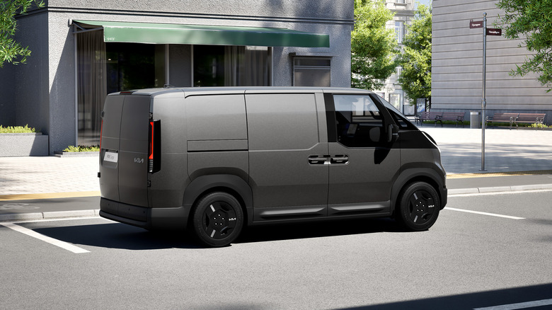 A Kia PV5 Cargo parked on a city street