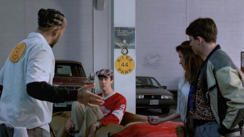 The garage scene from the film Ferris Bueller's Day Off but with Lewis Hamilton playing the part of the garage attendant