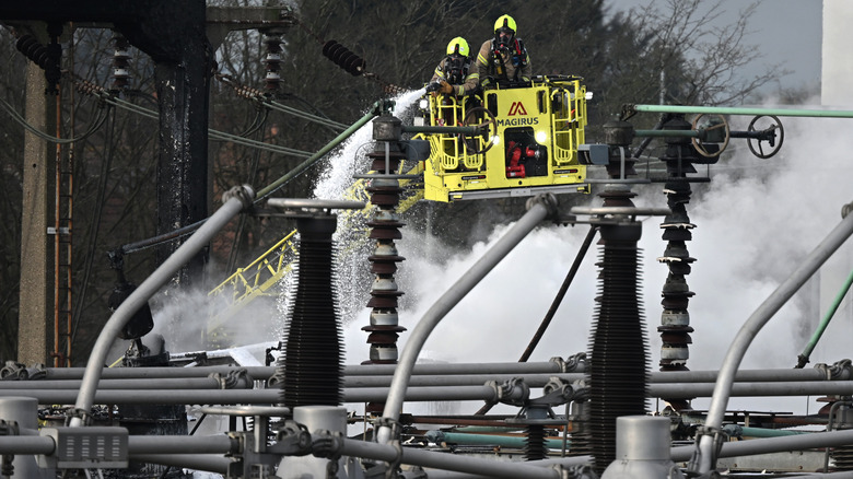 A photo of firefighters tackling a blaze at a sub station.