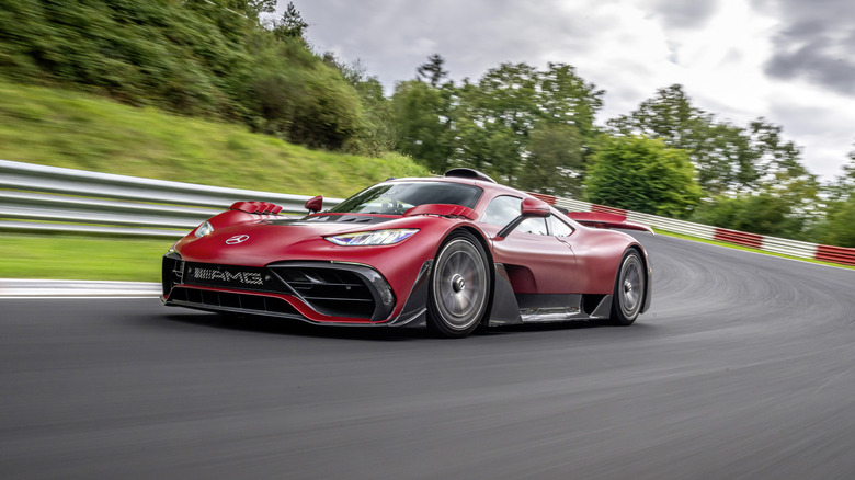 A red Mercedes-AMG ONE around the Nürburgring-Nordschleife