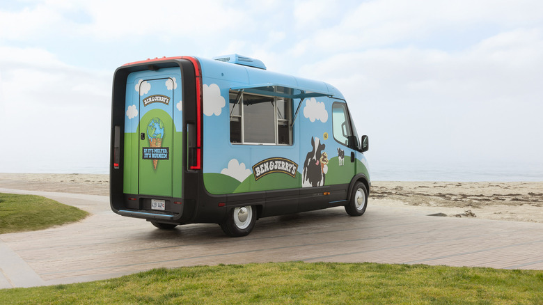 A Ben & Jerry's Rivian scoop truck parked at the beach.