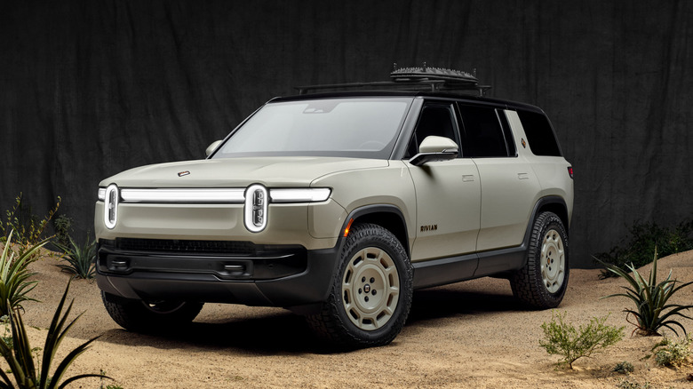 Front 3/4 view of a beige Rivian R1S California Dune Edition