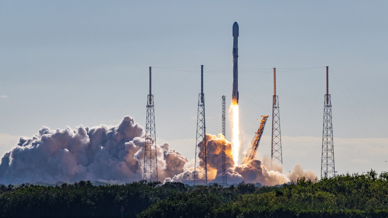 A photo of a Space X rocket launching in America.