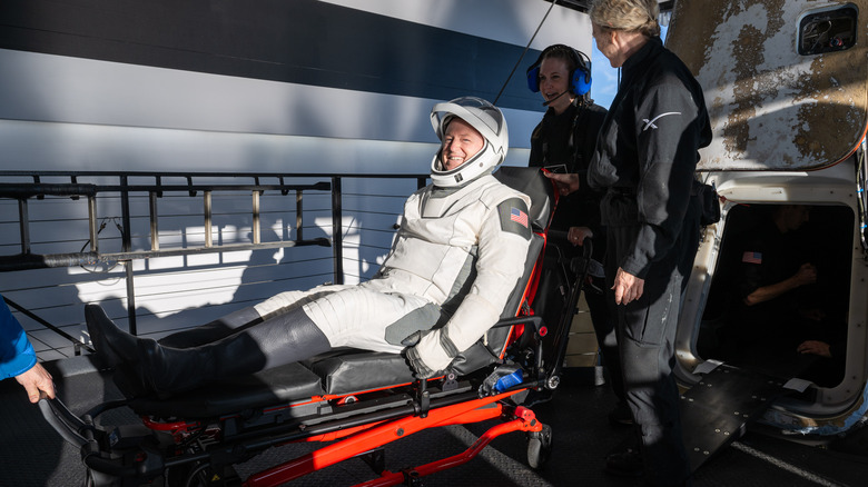 NASA astronaut Butch Wilmore is helped out of the SpaceX Dragon spacecraft onboard the SpaceX recovery ship MEGAN after he and fellow NASA astronauts Nick Hague and Suni Williams, and Roscosmos cosmonaut Aleksandr Gorbunov landed on the water on March 18, 2025 off the coast of Tallahassee, Florida.