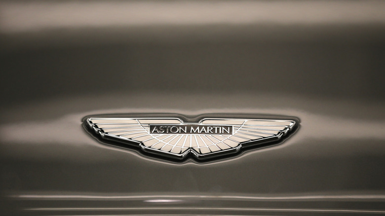 A photo of the Aston Martin wings logo.