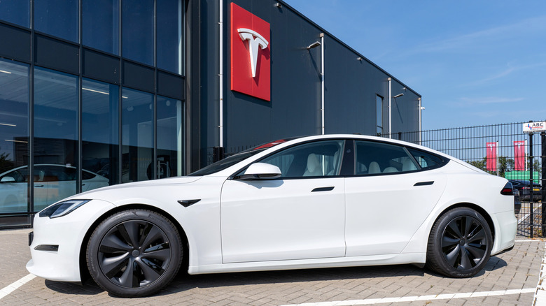 A photo of a Tesla at a dealer.