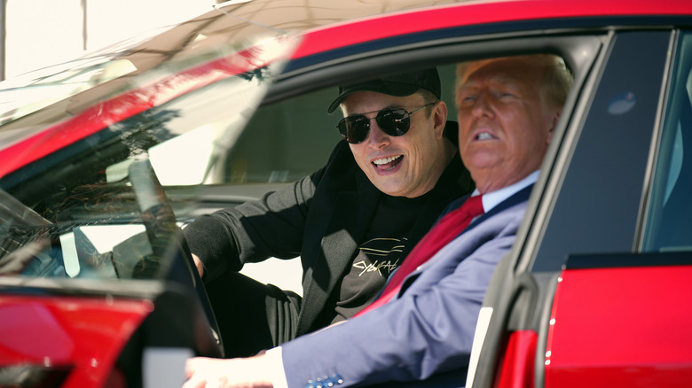 Donald Trump and Elon Musk sitting in a Tesla Model S