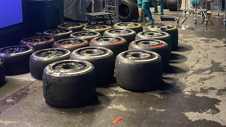 a bunch of F1 tires sitting on the ground at F1 Vegas