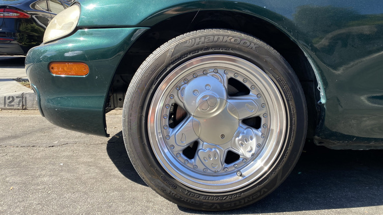 close up of Ronal Teddies on a green NB Miata