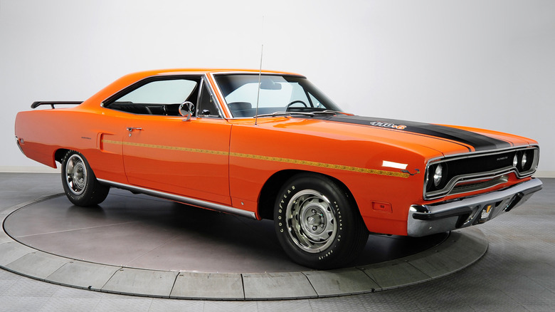 A photo of an orange Plymouth Roadrunner muscle car.