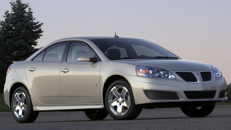 A photo of a beige Pontiac sedan.