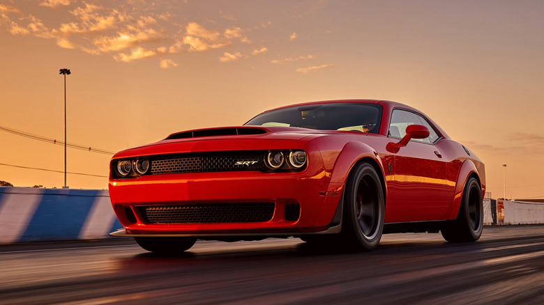 A photo of a red Dodge Challenger muscle car.