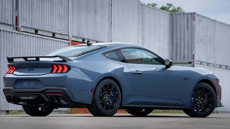 A photo of the rear quarter of a Ford Mustang muscle car.