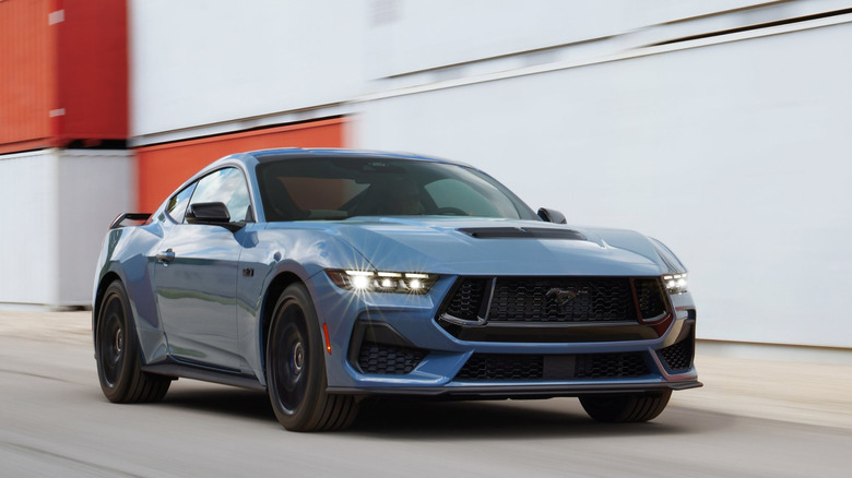 A photo of a blue Ford Mustang muscle car.