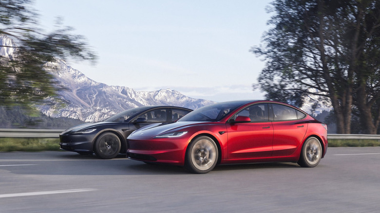 A photo of two Tesla Model 3 electric cars.