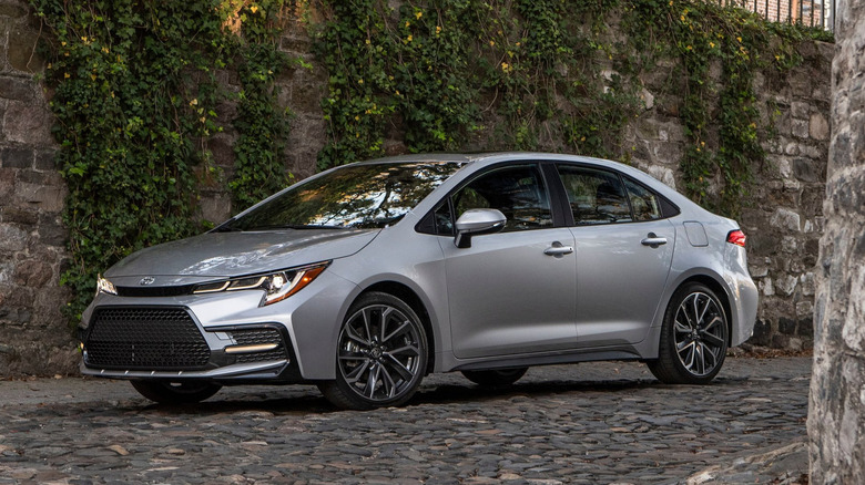 A photo of a grey Toyota Corolla sedan.