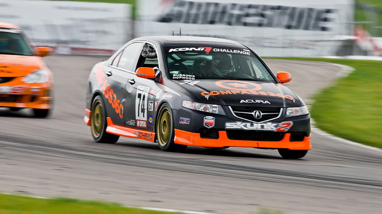 An Acura TSX racing on a track