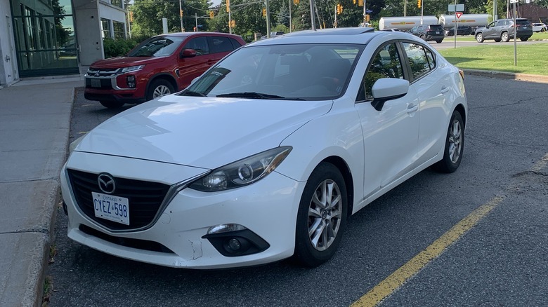 A white 2018 Mazda3 sedan