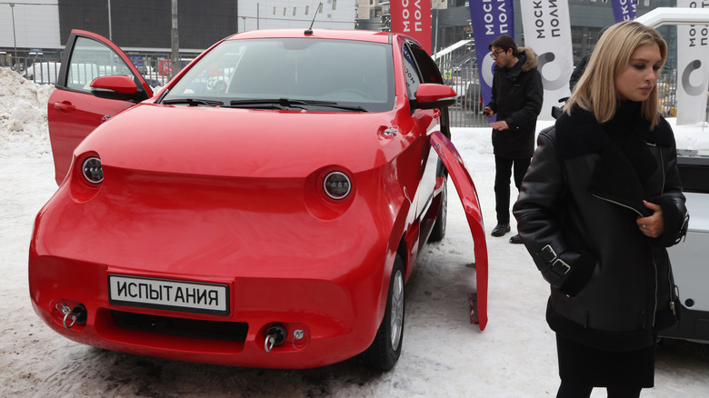 A photo of a red Avtotor Amber electric car.