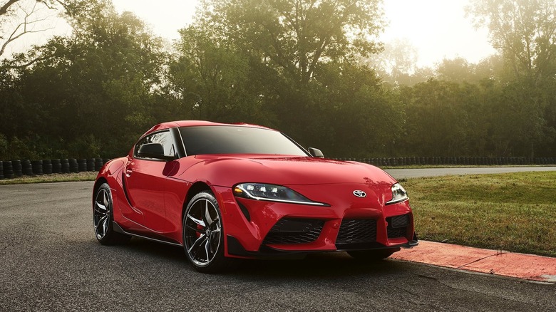 A photo of a red Toyota Supra sports car.