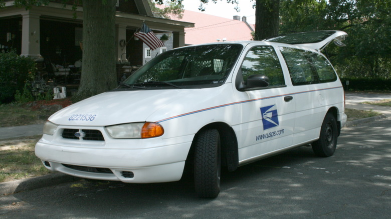 A USPS Ford Windstar mail delivery van parked on Watts Street in Durham, North Carolina.