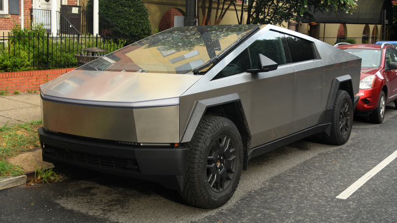 A Cybertruck parked on a residential street