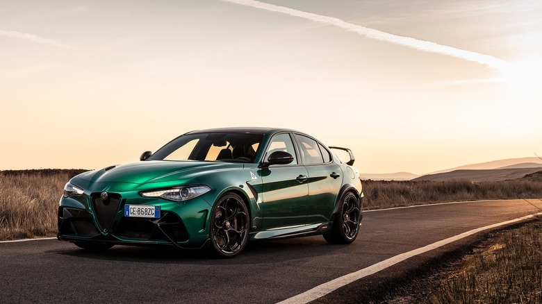 A photo of a green Alfa Romeo Giulia sedan.