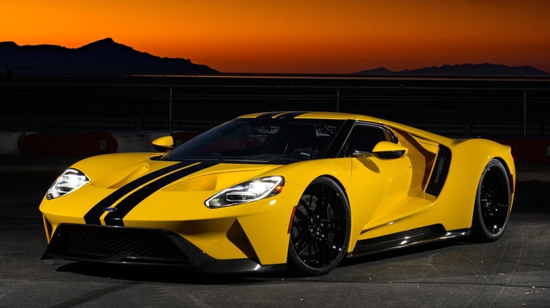 A photo of a yellow Ford GT supercar.