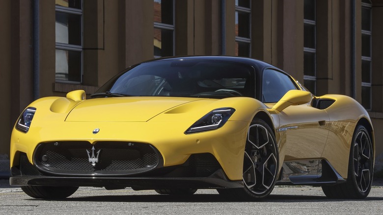 A photo of a yellow Maserati MC20 supercar.