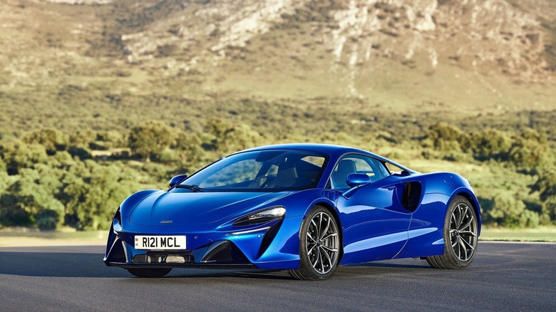 A photo of a blue McLaren Artura supercar.