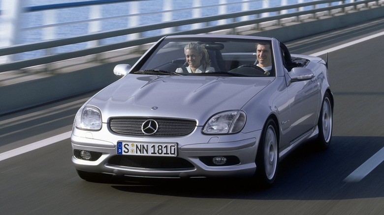 A photo of a silver SLK32 AMG sports car.