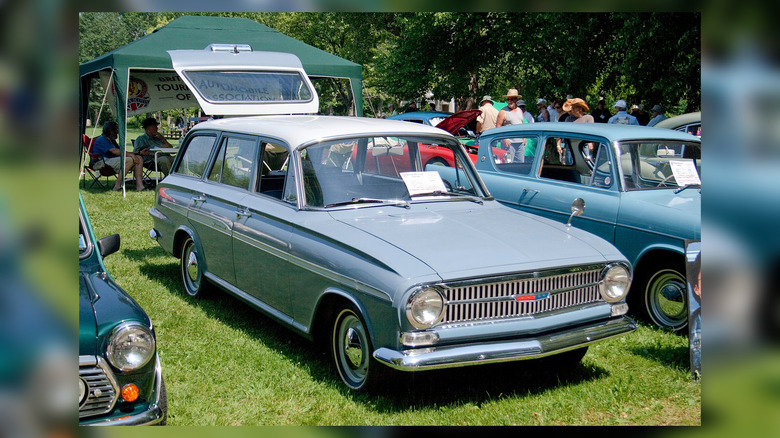 A light blue Envoy Sherwood Wagon with its rear hatch open.