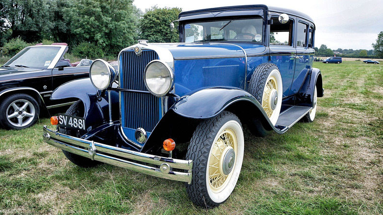 A 1930 Viking sedan parked in a grassy field.