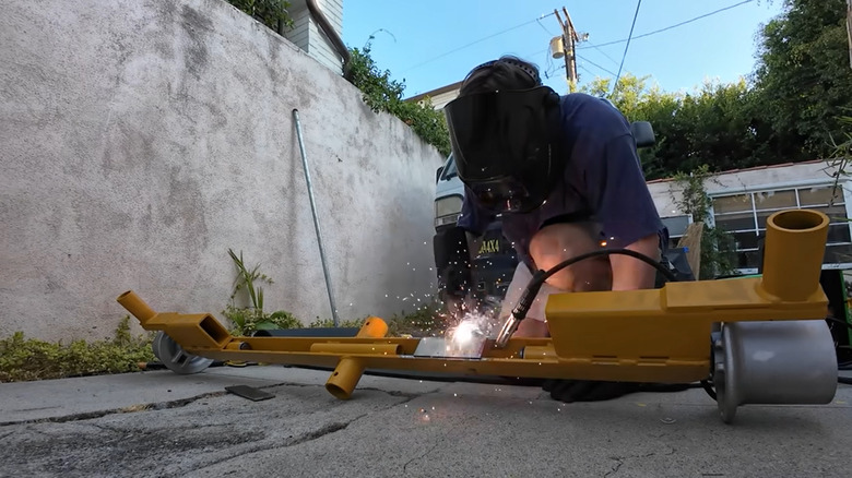 A screenshot of someone welding wheels.