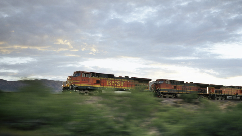 A photo of a BNSF train on the railway.